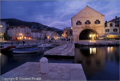 CROATIA - (Croazia) - ISOLA DI HVAR - Hvar - veduta serale del porto con l'arsenale veneziano