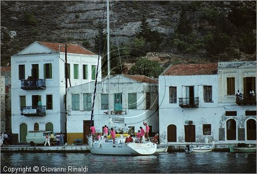 GREECE - (Dodecanese Island) - GRECIA (Dodecanneso) - ISOLA DI KASTELLORIZO (Megisti) - veduta delle tipiche casette del paese che si affacciano sullo specchio di mare del porto