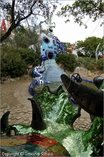 ITALY - Capalbio (GR) - localit Garavicchio - Il Giardino dei Tarocchi - opera originale e fantastica ideata dall'artista francese Niki de Saint Phalle. L'opera rappresenta i 22 Arcani Maggiori dei Tarocchi realizzati con fantastiche sculture di cemento armato e poliestere, ricoperte con mosaico di ceramica , vetri e specchi