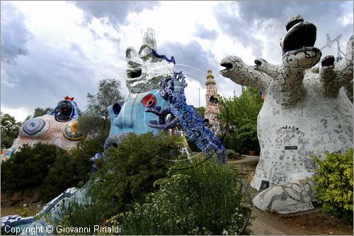 ITALY - Capalbio (GR) - localit Garavicchio - Il Giardino dei Tarocchi - opera originale e fantastica ideata dall'artista francese Niki de Saint Phalle. L'opera rappresenta i 22 Arcani Maggiori dei Tarocchi realizzati con fantastiche sculture di cemento armato e poliestere, ricoperte con mosaico di ceramica , vetri e specchi