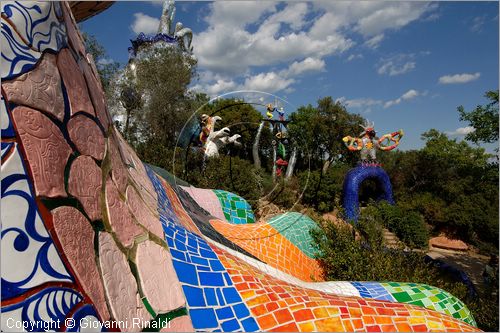 ITALY - Capalbio (GR) - localit Garavicchio - Il Giardino dei Tarocchi - opera originale e fantastica ideata dall'artista francese Niki de Saint Phalle. L'opera rappresenta i 22 Arcani Maggiori dei Tarocchi realizzati con fantastiche sculture di cemento armato e poliestere, ricoperte con mosaico di ceramica , vetri e specchi