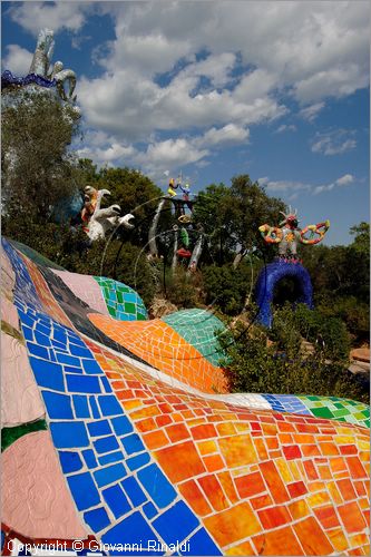 ITALY - Capalbio (GR) - localit Garavicchio - Il Giardino dei Tarocchi - opera originale e fantastica ideata dall'artista francese Niki de Saint Phalle. L'opera rappresenta i 22 Arcani Maggiori dei Tarocchi realizzati con fantastiche sculture di cemento armato e poliestere, ricoperte con mosaico di ceramica , vetri e specchi