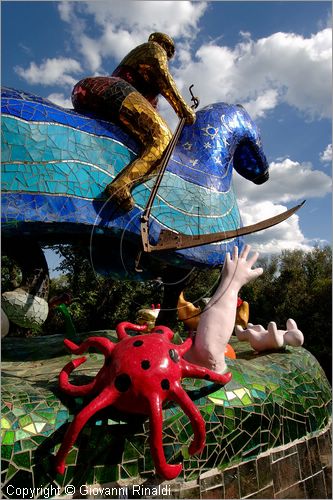 ITALY - Capalbio (GR) - localit Garavicchio - Il Giardino dei Tarocchi - opera originale e fantastica ideata dall'artista francese Niki de Saint Phalle. L'opera rappresenta i 22 Arcani Maggiori dei Tarocchi realizzati con fantastiche sculture di cemento armato e poliestere, ricoperte con mosaico di ceramica , vetri e specchi