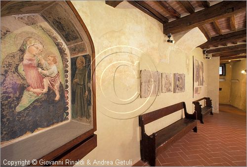 ITALY - ANGHIARI (AR) - Museo Statale di Palazzo Taglieschi - Sala VII: a sinistra affresco  con la Madonna col Bambino e San Francesco (dalla casa Sassolini a Castelfranco di sotto)