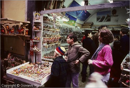 ITALY - NAPOLI - Via di San Gregorio Armeno con gli artigiani che vendono i presepi durante il natale